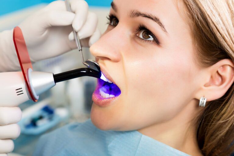 The reception was at the female dentist. Doctor examines the oral cavity on tooth decay.